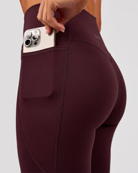 Woman wearing Fusion V Contour Ultra High-Rise 3/4 Legging Pockets - Cherry Lacquer | Model:Charli | Size:XS | Thumbnail Index: 2