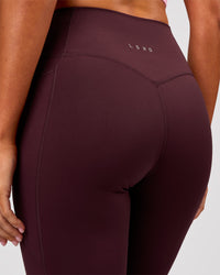 Woman wearing Fusion V Contour Ultra High-Rise 3/4 Legging Pockets - Cherry Lacquer | Model:Charli | Size:XS | Thumbnail Index: 6