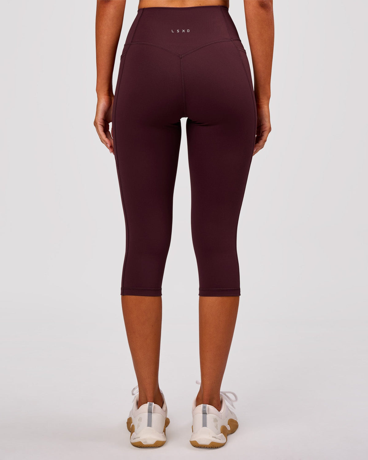 Woman wearing Fusion V Contour Ultra High-Rise 3/4 Legging Pockets - Cherry Lacquer | Model:Charli | Size:XS
