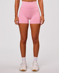 Woman wearing Fusion V-Contour Ultra High-Rise 4" Short Pockets - Pink Rose | Model:Charli | Size:XS | Thumbnail Index: 6