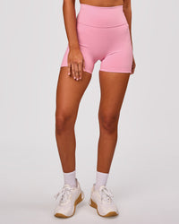 Woman wearing Fusion V-Contour Ultra High-Rise 4" Short Pockets - Pink Rose | Model:Charli | Size:XS | Thumbnail Index: 7