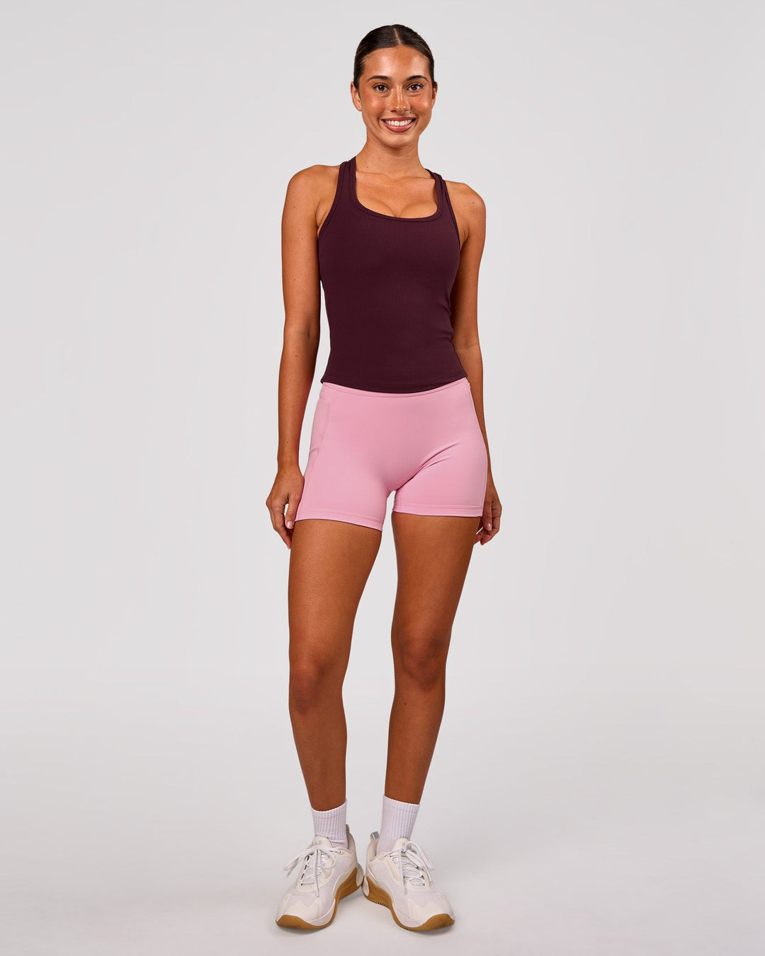 Woman wearing Fusion V-Contour Ultra High-Rise 4" Short Pockets - Pink Rose | Model:Charli | Size:XS - view 9