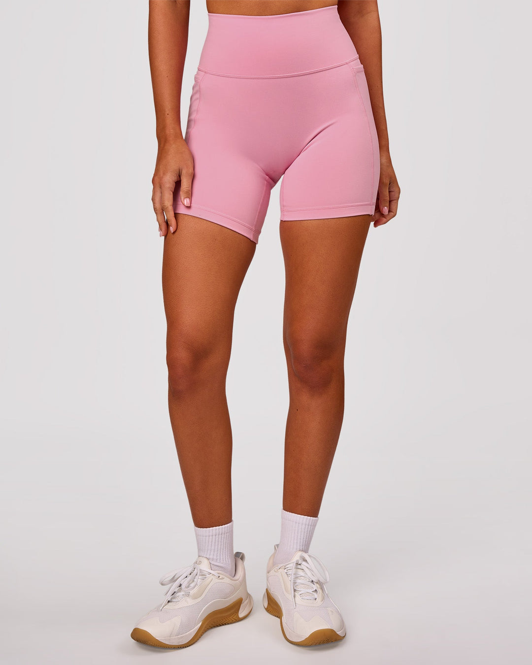Woman wearing Fusion V-Contour Ultra High-Rise 6" Short Pockets - Pink Rose | Model:Charli | Size:XS - view 6