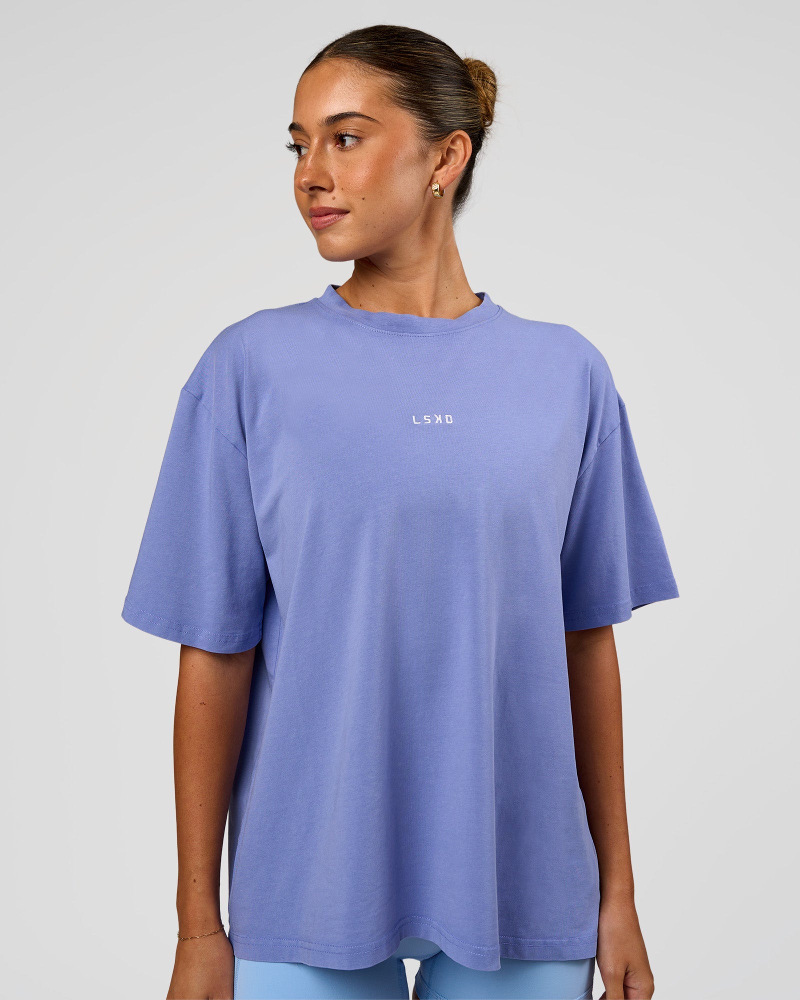 Woman wearing Go-To FLXCotton Oversized Tee - Bluebell Washed-White | Model:Charli | Size:XS