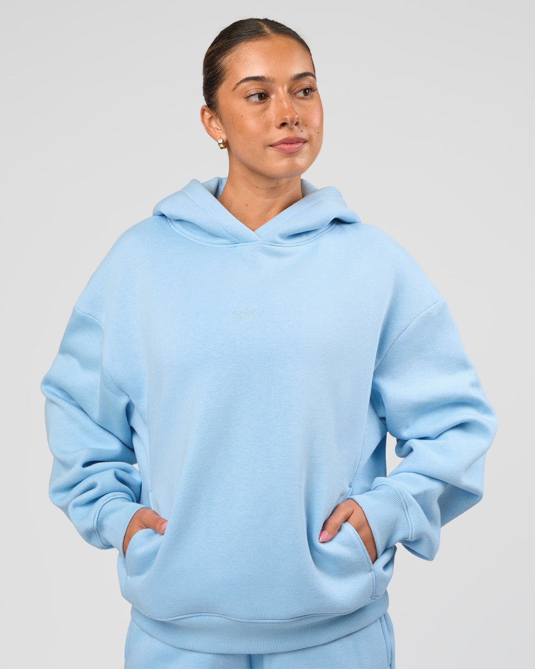 Woman wearing Go-To Script Oversized Hoodie - Open Air | Model:Charli | Size:XS