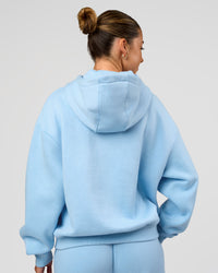 Woman wearing Go-To Script Oversized Hoodie - Open Air | Model:Charli | Size:XS