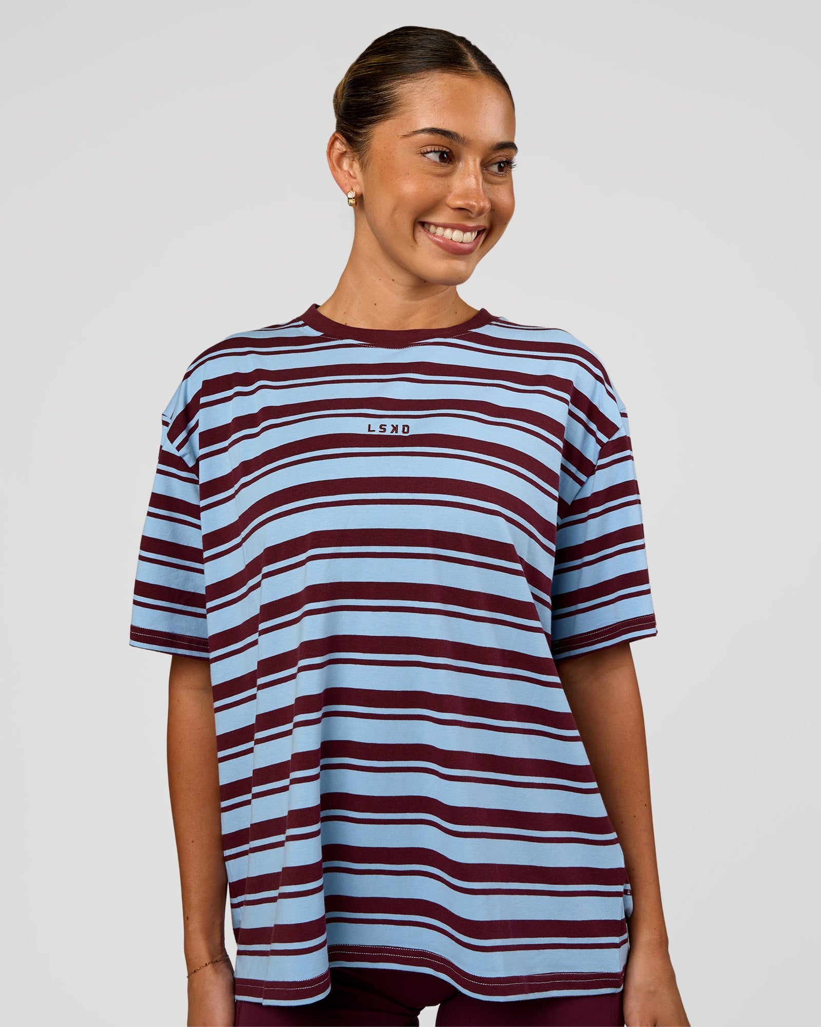 Woman wearing Go-To Shadow Stripe FLXCotton Oversized Tee - Open Air-Cherry Lacquer | Model:Charli | Size:XS