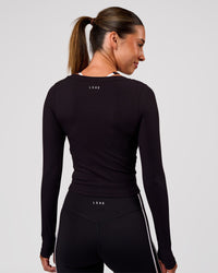 Woman wearing Horizon Long Sleeve Tee - Black | Model:Charli | Size:XS | Thumbnail Index: 9