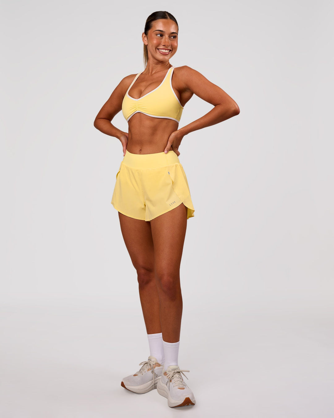 Woman wearing Luminous Sports Bra - Lemon-White | Model:Charli | Size:XS - view 6