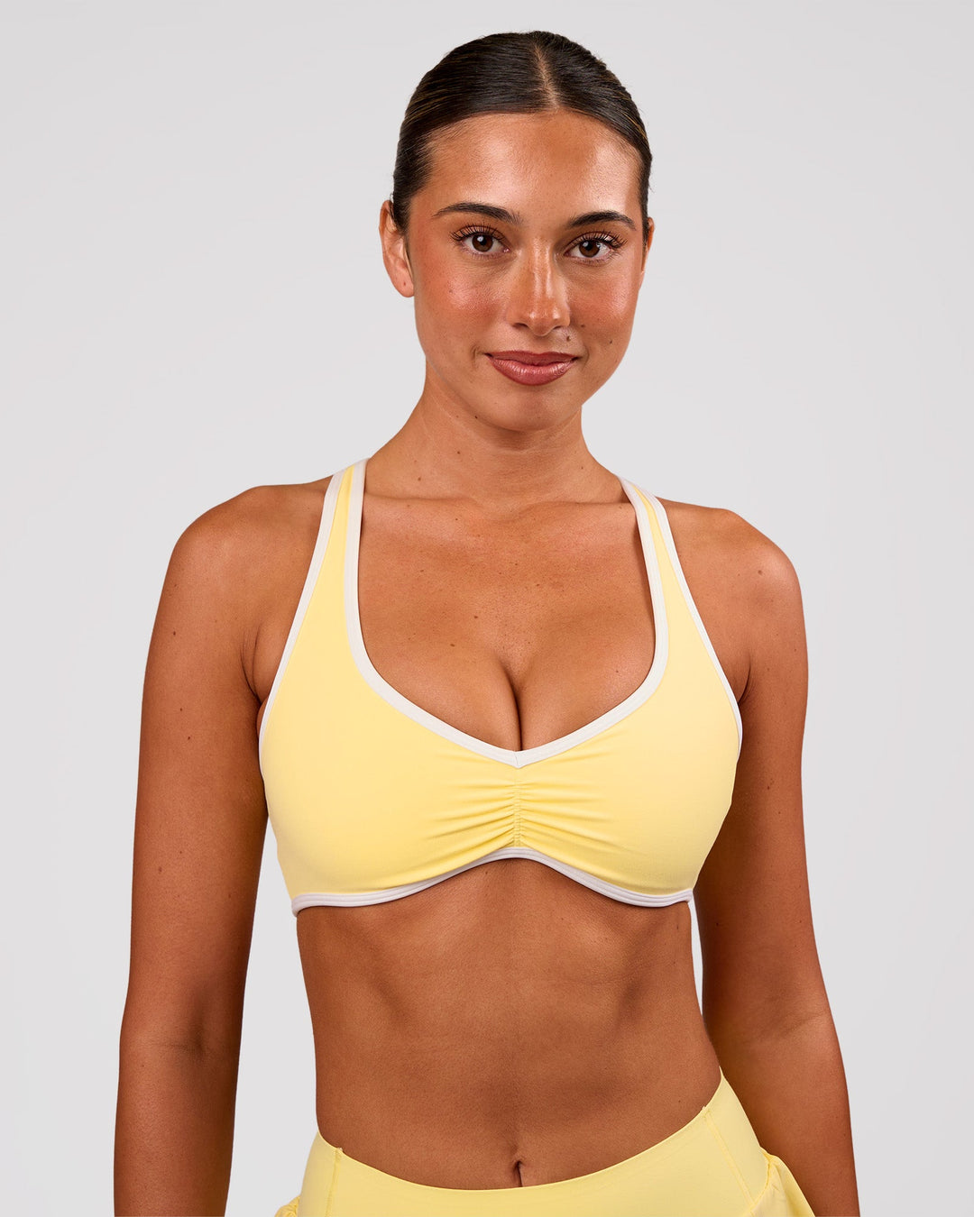 Woman wearing Luminous Sports Bra - Lemon-White | Model:Charli | Size:XS - view 8