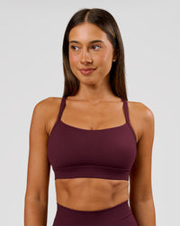 Woman wearing Momentum Sports Bra D/DD/E - Cherry Lacquer | Model:Charli | Size:XS | Thumbnail Index: 0