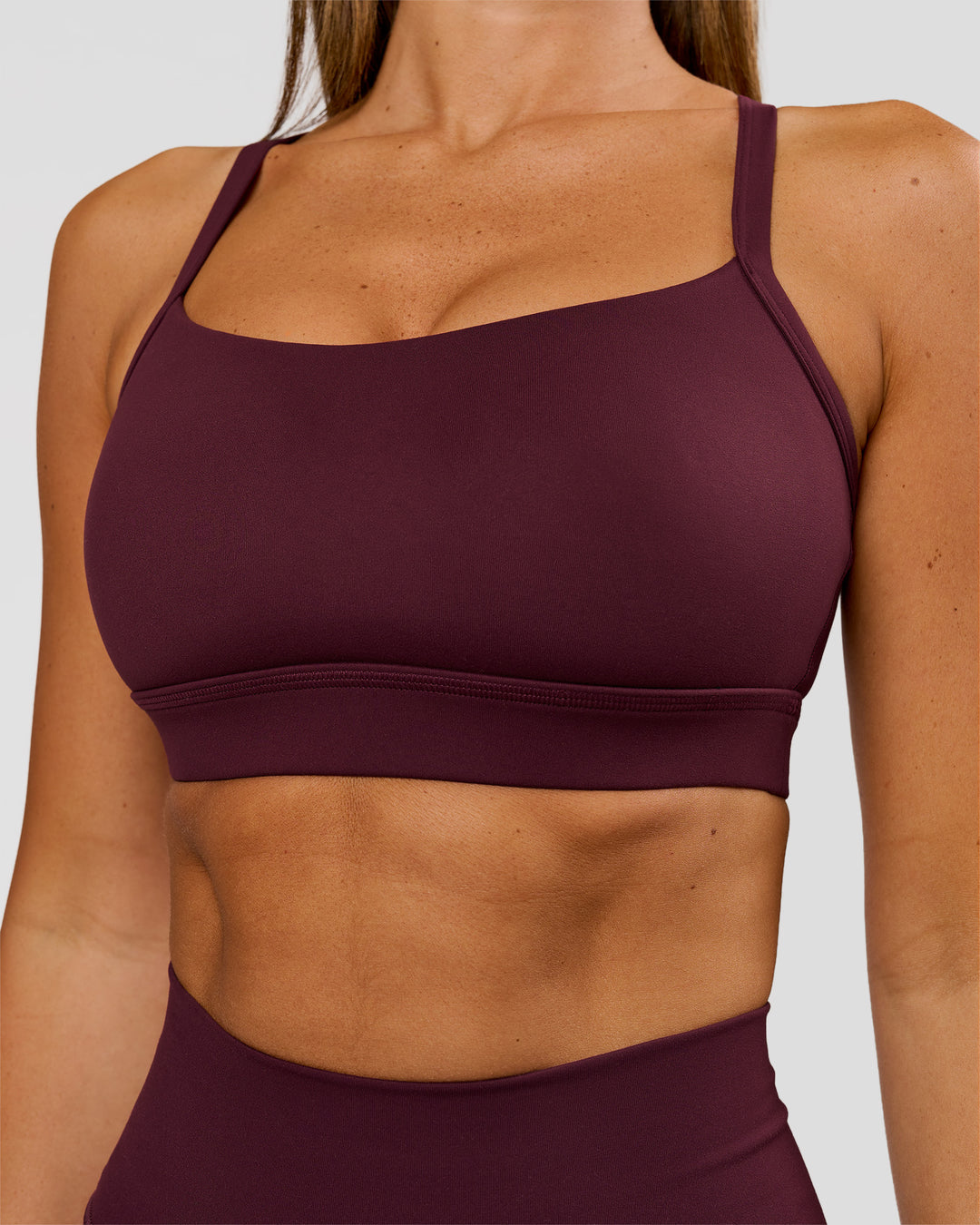 Woman wearing Momentum Sports Bra D/DD/E - Cherry Lacquer | Model:Charli | Size:XS - view 3