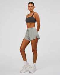 Woman wearing Momentum Sports Bra - Onyx | Model:Charli | Size:XS | Thumbnail Index: 4