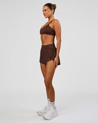 Woman wearing Pacer 3" Run Short - Hot Chocolate | Model:Charli | Size:XS | Thumbnail Index: 4