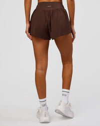 Woman wearing Pacer 3" Run Short - Hot Chocolate | Model:Charli | Size:XS | Thumbnail Index: 7