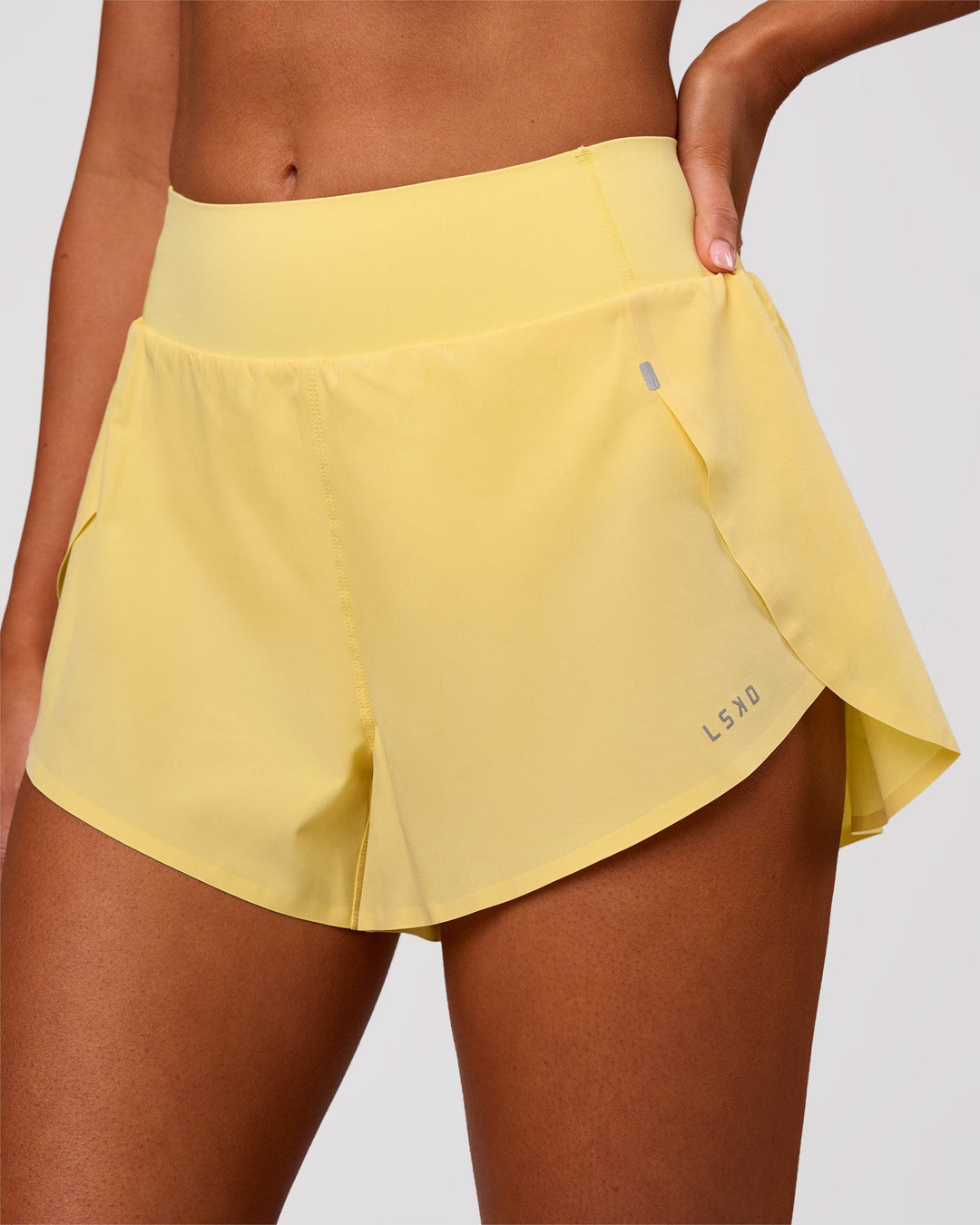 Woman wearing Pacer 3" Run Short - Lemon | Model:Charli | Size:XS - view 1