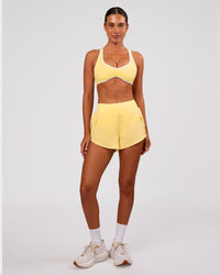 Woman wearing Pacer 3" Run Short - Lemon | Model:Charli | Size:XS | Thumbnail Index: 2