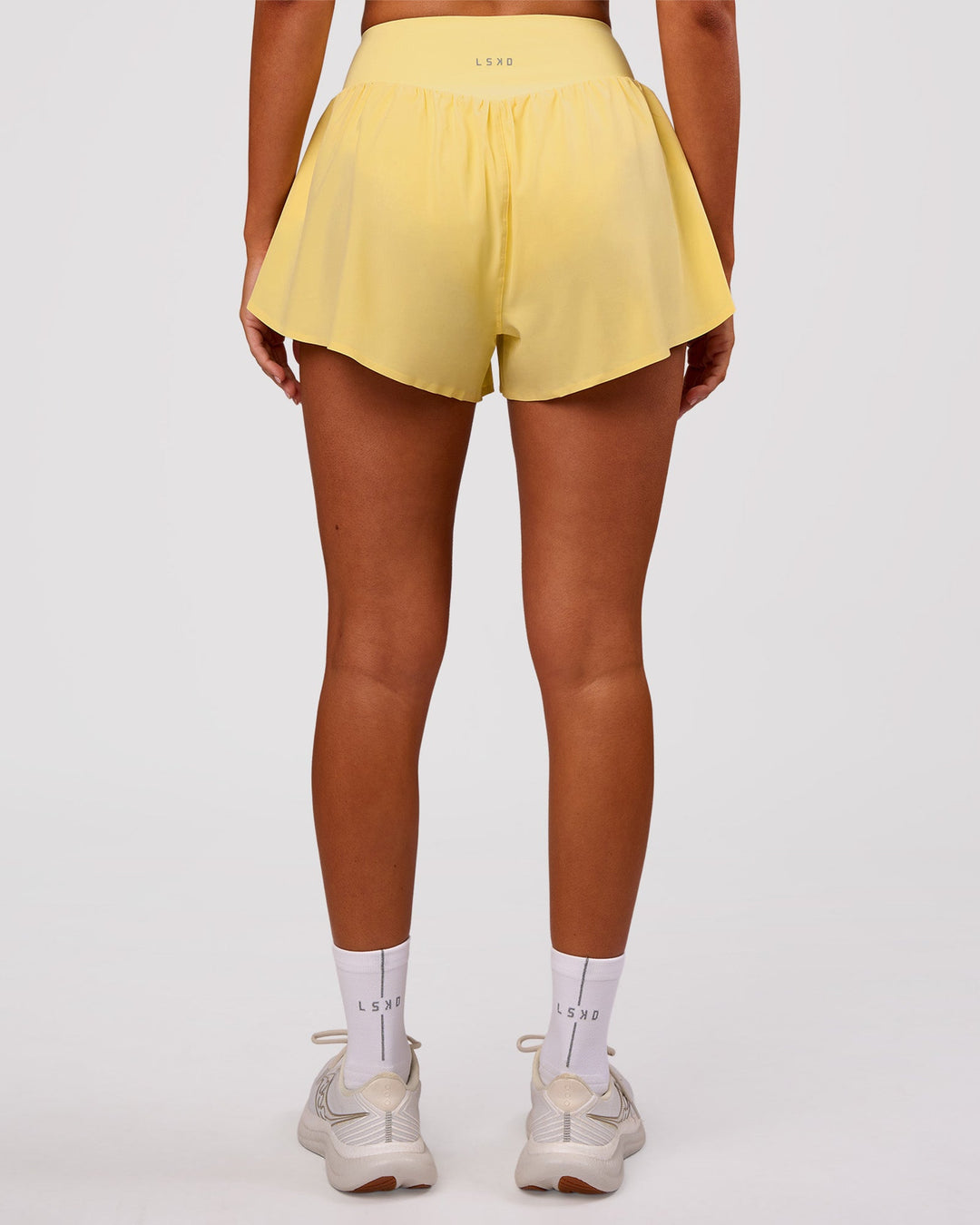 Woman wearing Pacer 3" Run Short - Lemon | Model:Charli | Size:XS - view 7
