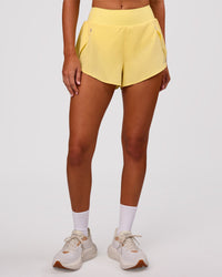 Woman wearing Pacer 3" Run Short - Lemon | Model:Charli | Size:XS | Thumbnail Index: 9