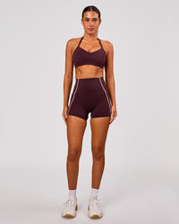 Woman wearing Power Ultra High-Rise 4" Short Pockets - Cherry Lacquer-Pink Rose | Model:Charli | Size:XS | Thumbnail Index: 2