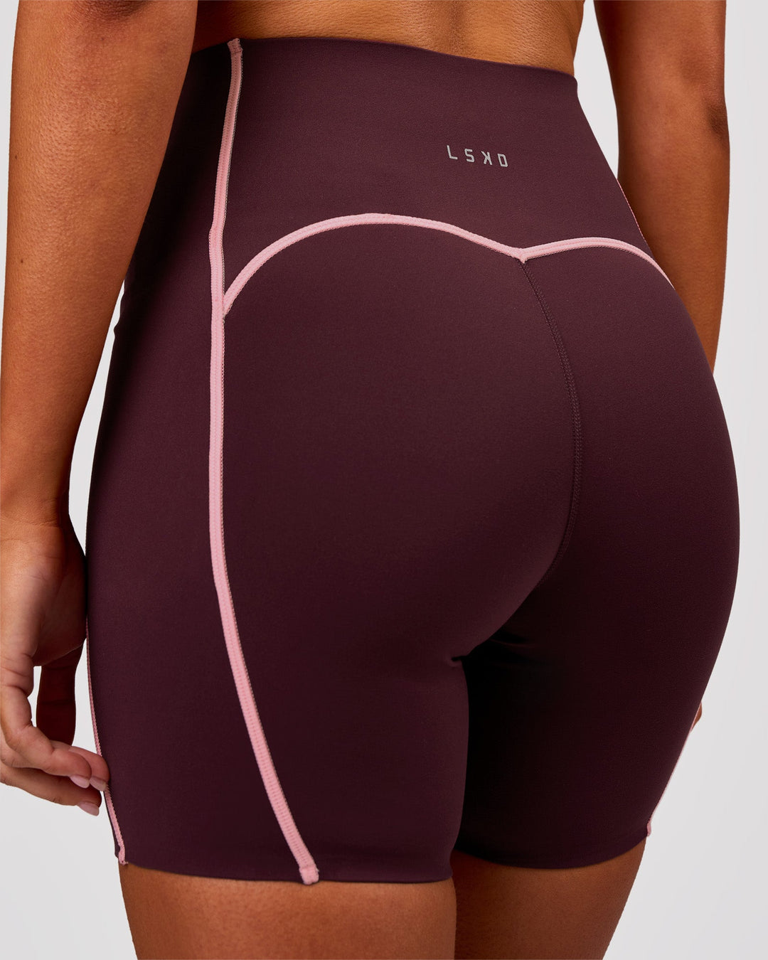 Woman wearing Power Ultra High-Rise 6" Short Pockets - Cherry Lacquer-Pink Rose | Model:Charli | Size:XS - view 2