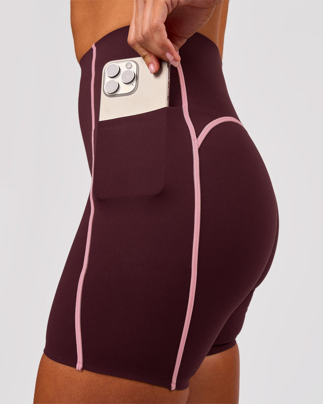 Woman wearing Power Ultra High-Rise 6" Short Pockets - Cherry Lacquer-Pink Rose | Model:Charli | Size:XS - view 3