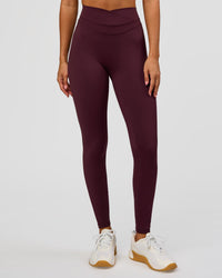 Woman wearing Solstice High-Rise Full Length Legging - Cherry Lacquer | Model:Charli | Size:XS | Thumbnail Index: 1
