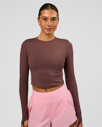 Woman wearing Staple Long Sleeve Cropped Tee 2.0 - Cocoa Powder | Model:Charli | Size:XS | Thumbnail Index: 0