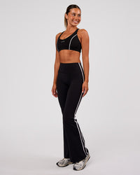 Woman wearing Stellar Sports Bra - Black-White | Model:Charli | Size:XS | Thumbnail Index: 3