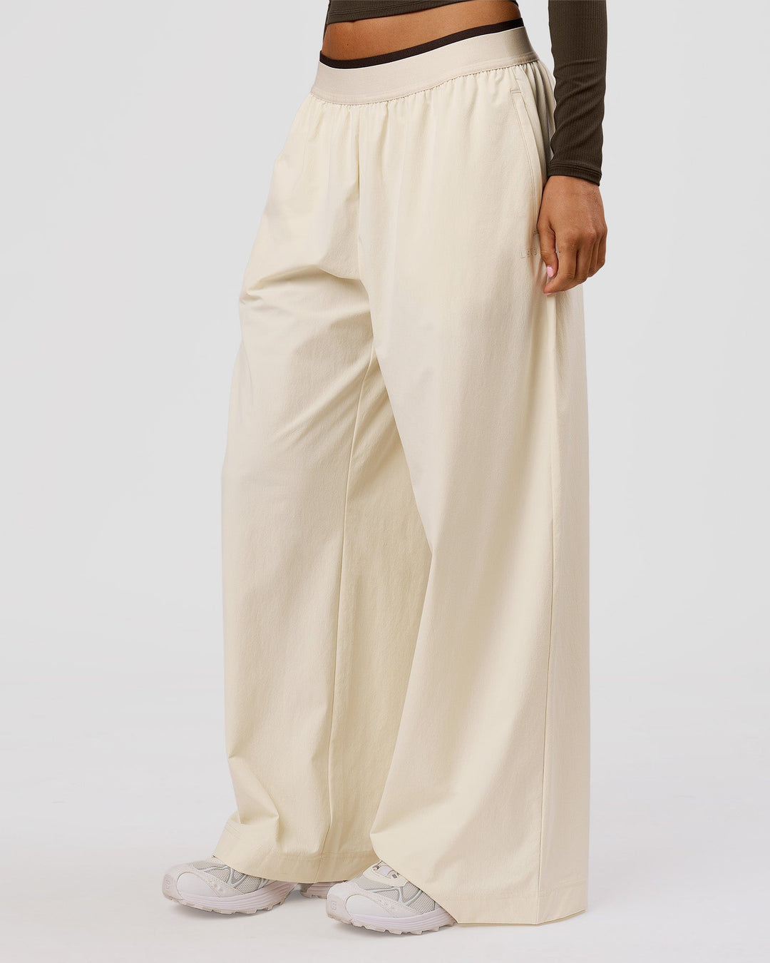 Woman wearing Stride Wide Leg Pant - Vanilla Bean | Model:Charli | Size:XS - view 2
