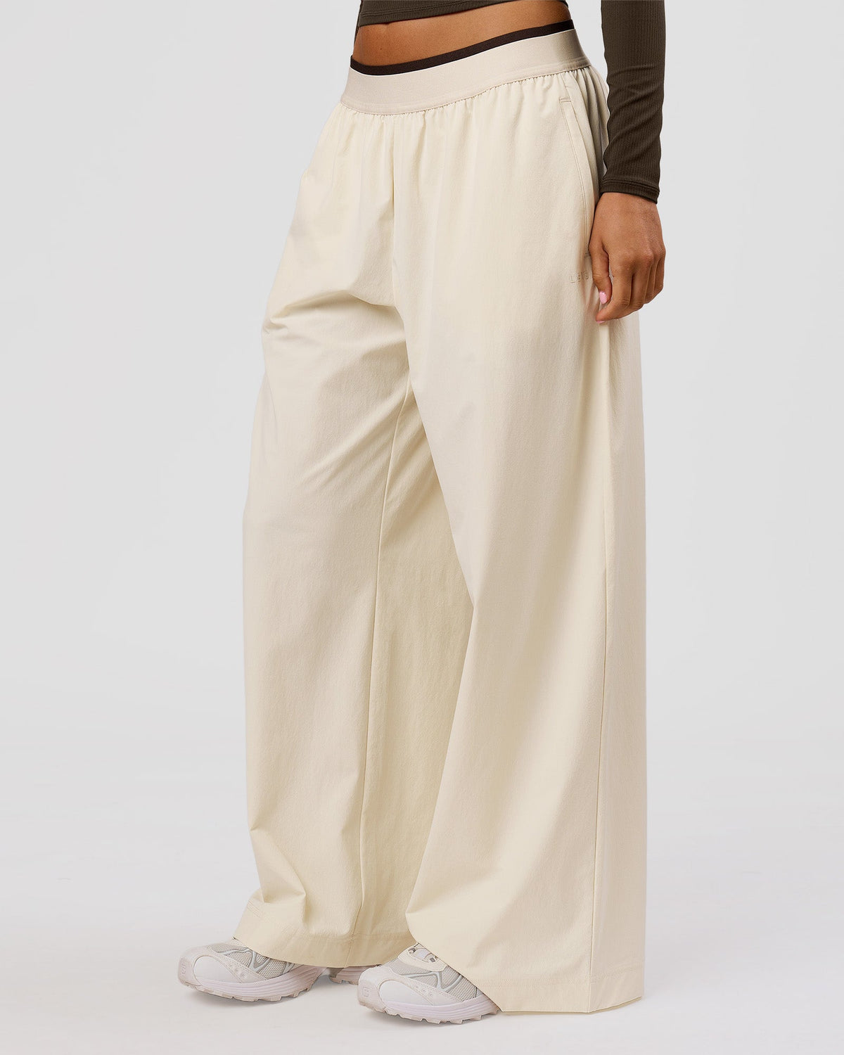 Woman wearing Stride Wide Leg Pant - Vanilla Bean | Model:Charli | Size:XS - view 2