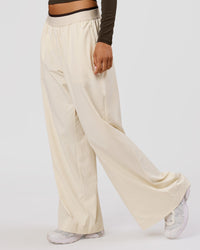 Woman wearing Stride Wide Leg Pant - Vanilla Bean | Model:Charli | Size:XS | Thumbnail Index: 3