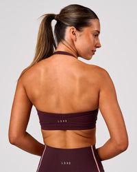 Woman wearing Unleash Sports Bra - Cherry Lacquer | Model:Charli | Size:XS | Thumbnail Index: 1