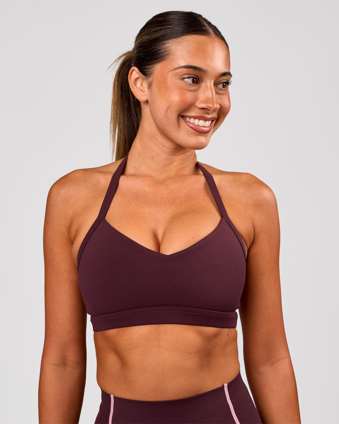 Woman wearing Unleash Sports Bra - Cherry Lacquer | Model:Charli | Size:XS - view 3
