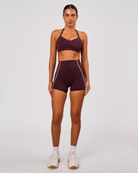 Woman wearing Unleash Sports Bra - Cherry Lacquer | Model:Charli | Size:XS | Thumbnail Index: 3