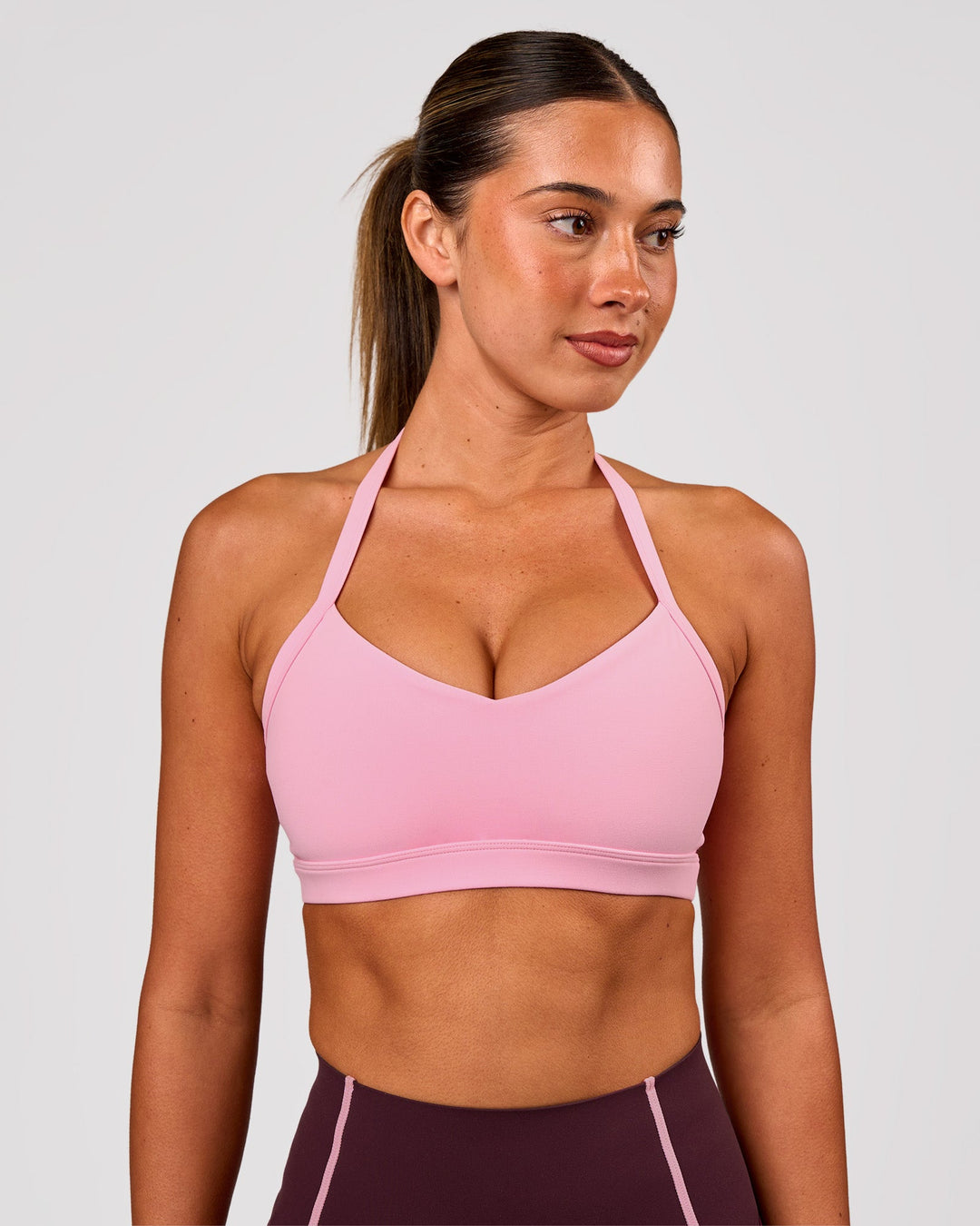 Woman wearing Unleash Sports Bra - Pink Rose | Model:Charli | Size:XS - view 3