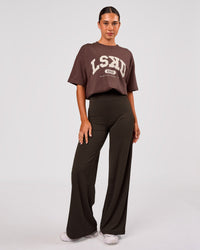 Woman wearing Varsity EST Heavyweight Oversized Tee  - Cocoa Powder-Off White | Model:Charli | Size:XS | Thumbnail Index: 8