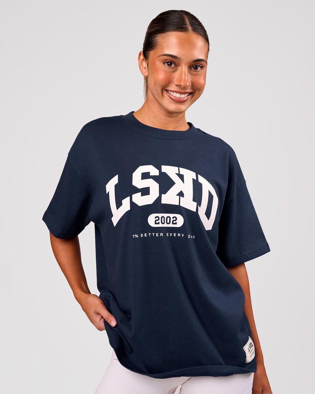 Woman wearing Varsity EST Heavyweight Oversized Tee  - Future Navy-White | Model:Charli | Size:XS - view 3
