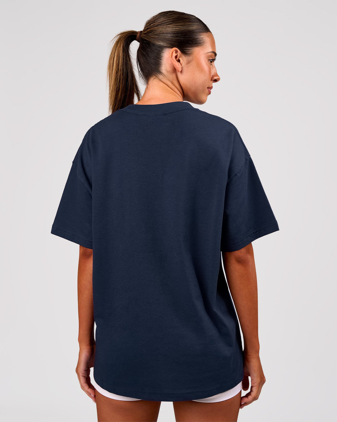 Woman wearing Varsity EST Heavyweight Oversized Tee  - Future Navy-White | Model:Charli | Size:XS - view 4