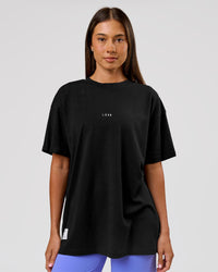 Woman wearing VS26 1% Better FLXCotton Oversize Tee - Black-White | Model:Charli | Size:XS | Thumbnail Index: 5