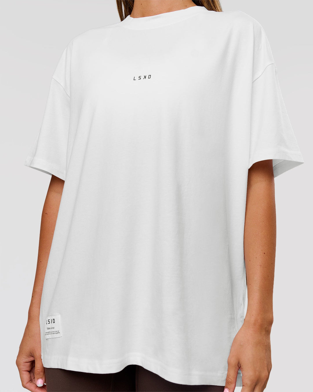Woman wearing VS26 1% Better FLXCotton Oversize Tee - White-Black | Model:Charli | Size:XS - view 15