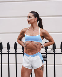 Woman wearing Strong is Beautiful Sports Bra - Open Air-White | Model:Charlotte | Size:XS | Thumbnail Index: 12
