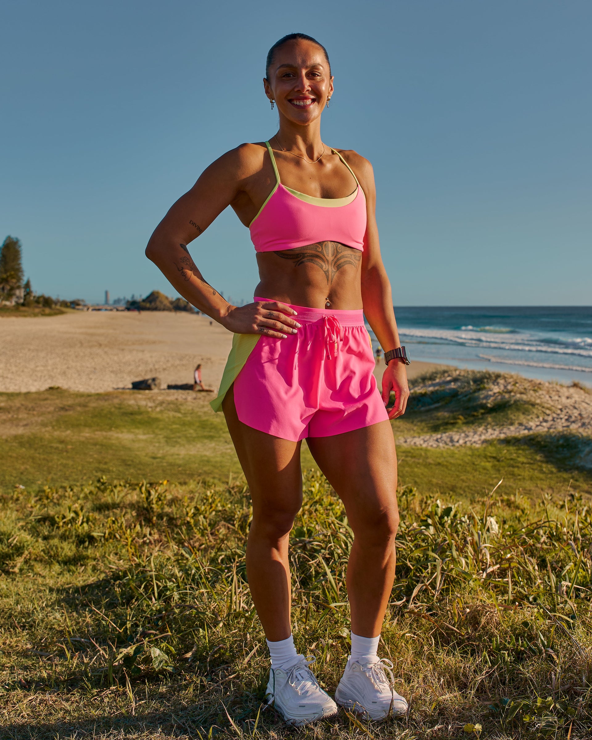 Woman wearing Accelerate 3" High-Rise Running Short - Lime Glo-Sugar Plum | Model:Chelsea | Size:XS