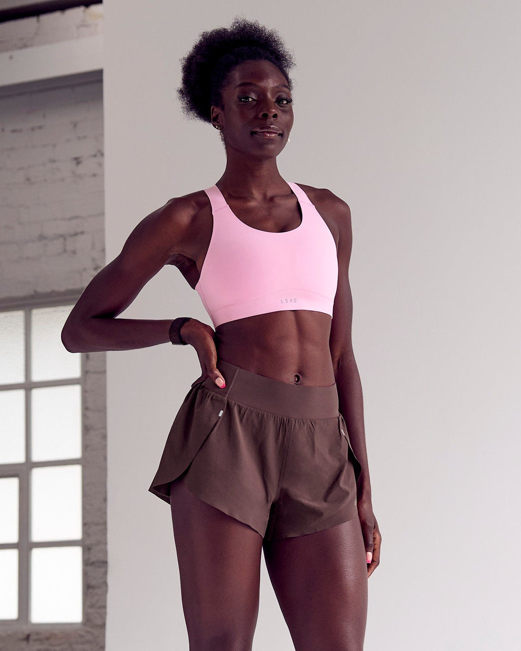 Woman wearing Pacer 3" Run Short - Cocoa Powder | Model:Desleigh | Size:XS