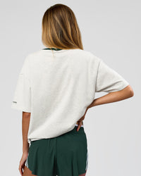 Woman wearing Be Here Now Heavyweight FLXCotton Tee Oversize - Silver Marl-Midnight Green | Model:Georgia | Size:XS | Thumbnail Index: 9