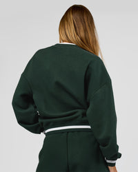 Woman wearing Go-To Dual Oversized Sweater - Midnight Green-White | Model:Georgia | Size:XS | Thumbnail Index: 5