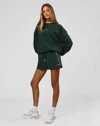 Woman wearing Go-To Dual Oversized Sweater - Midnight Green-White | Model:Georgia | Size:XS | Thumbnail Index: 9