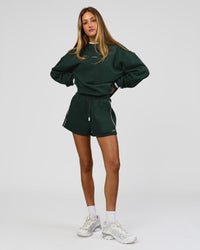 Woman wearing Go-To Dual Oversized Sweater - Midnight Green-White | Model:Georgia | Size:XS | Thumbnail Index: 11