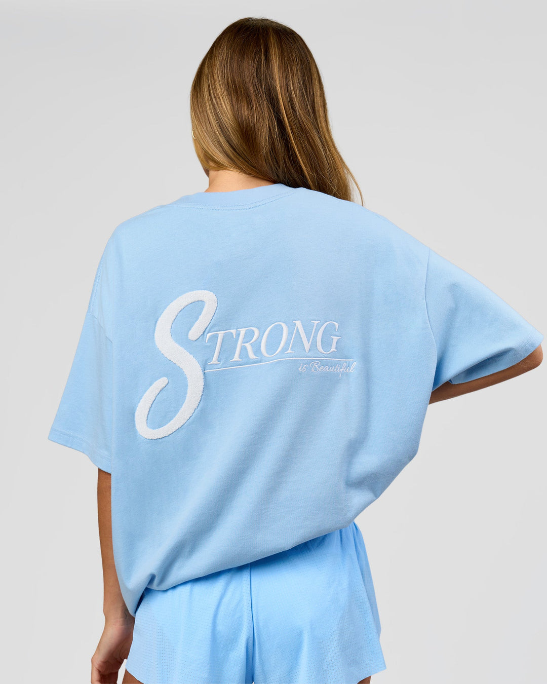 Woman wearing Strong is Beautiful Heavyweight Oversized Tee - Open Air | Model:Georgia | Size:XS - view 5