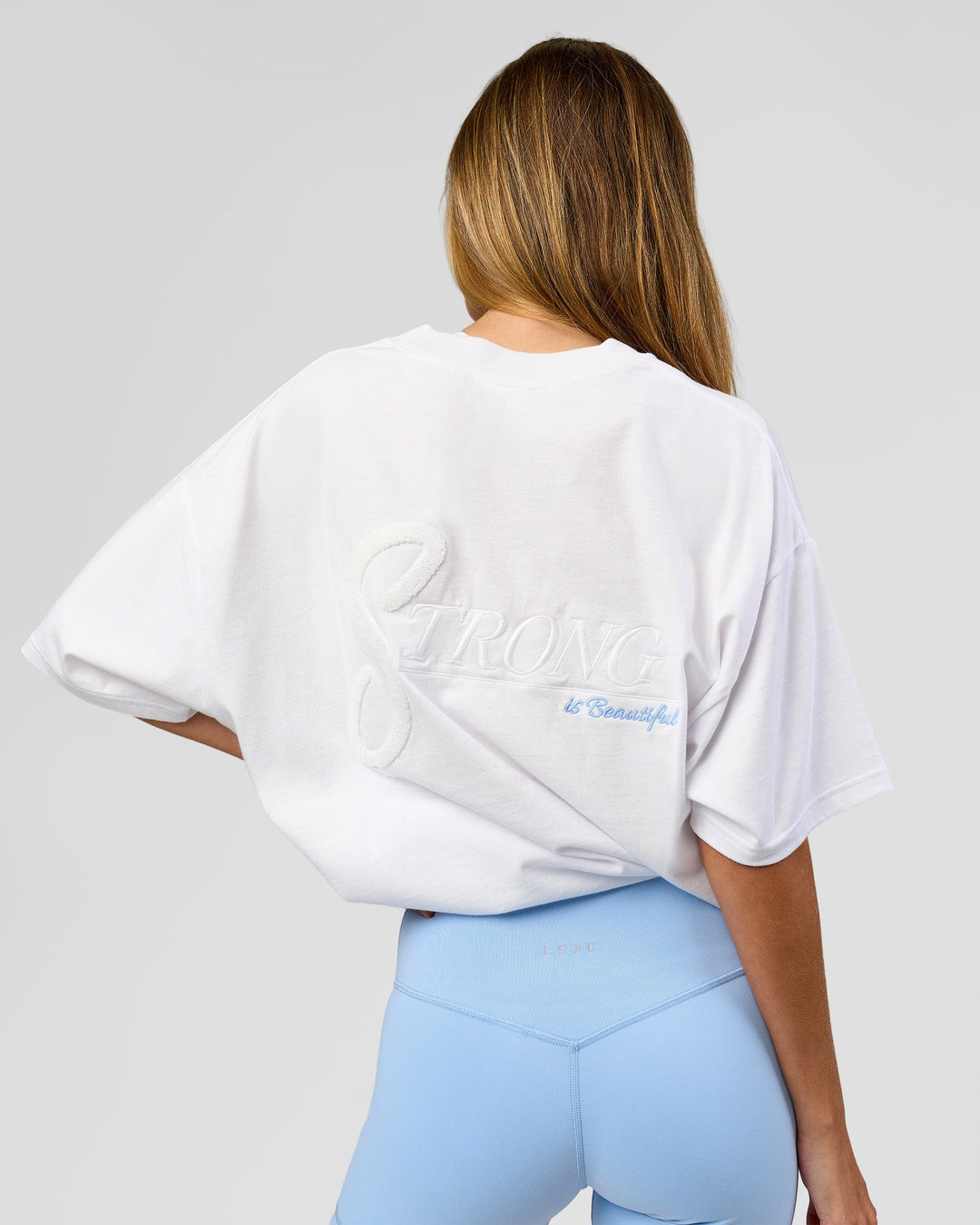 Woman wearing Strong is Beautiful Heavyweight Oversized Tee - White | Model:Georgia | Size:XS - view 10